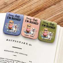 Three colorful personalized custom leather bookmark with cartoon characters and text on a book page.