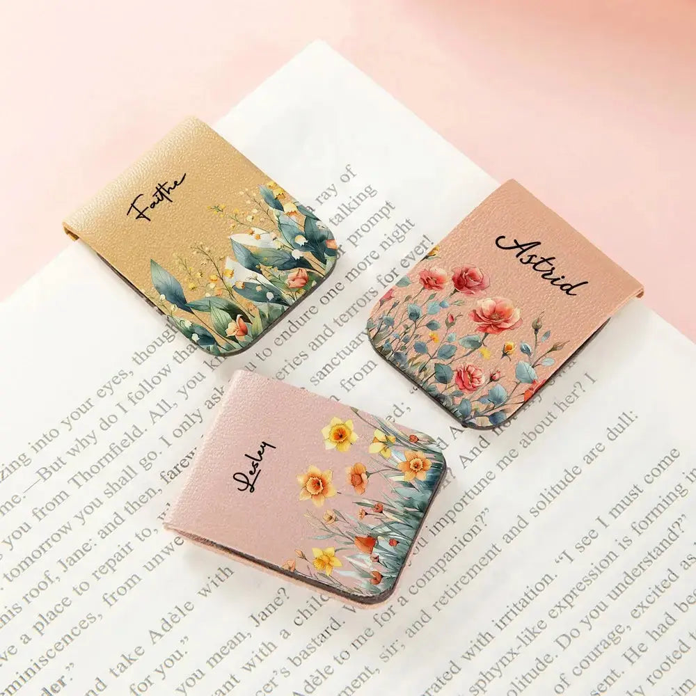 Three floral custom magnetic leather bookmark clip with names on a book page