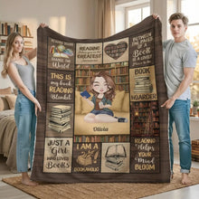 Two people holding a custom reading nook cozy throw