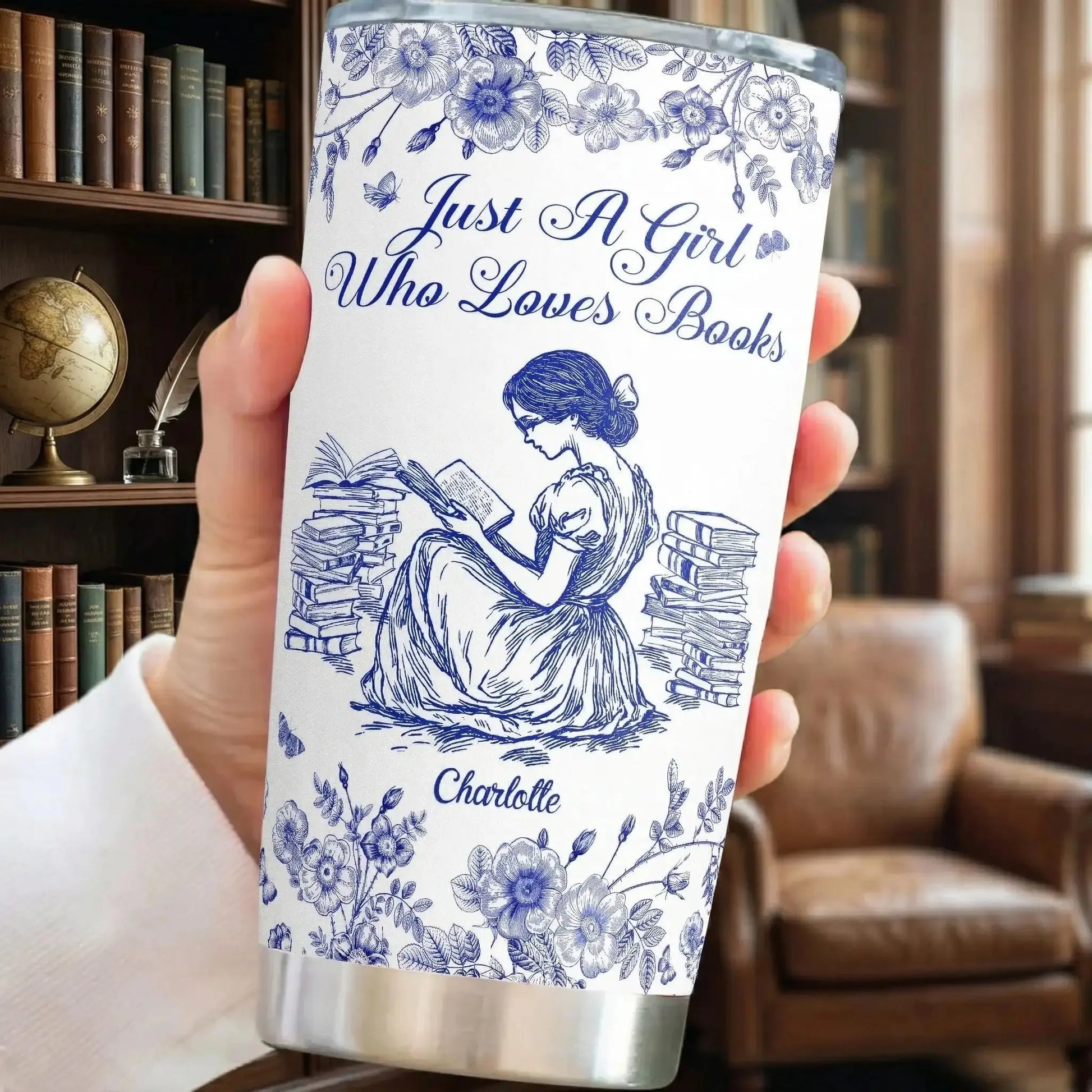 Woman reading a classic novel holding her personalized tumbler cup