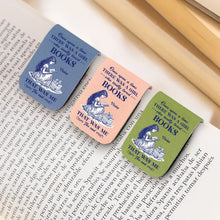 Three personalized custom leather bookmarks with illustrations and text on a book page.