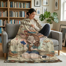 Woman holding a cup of tea wrapped in a personalized blanket for book lovers.
