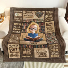 A bookish cozy fleece blanket draped elegantly over a sofa.