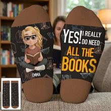 Woman resting her feet on a sofa wearing custom crew socks.