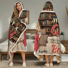 A young woman reading a novel wearing a personalized wearable blanket hoodie