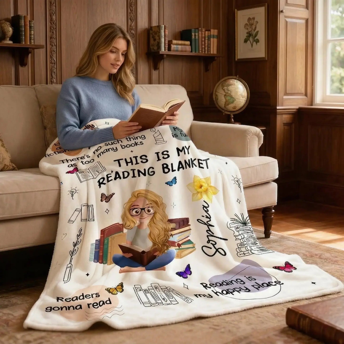 A woman sitting in a sunlit nook using a personalized book blanket with birth flowers.