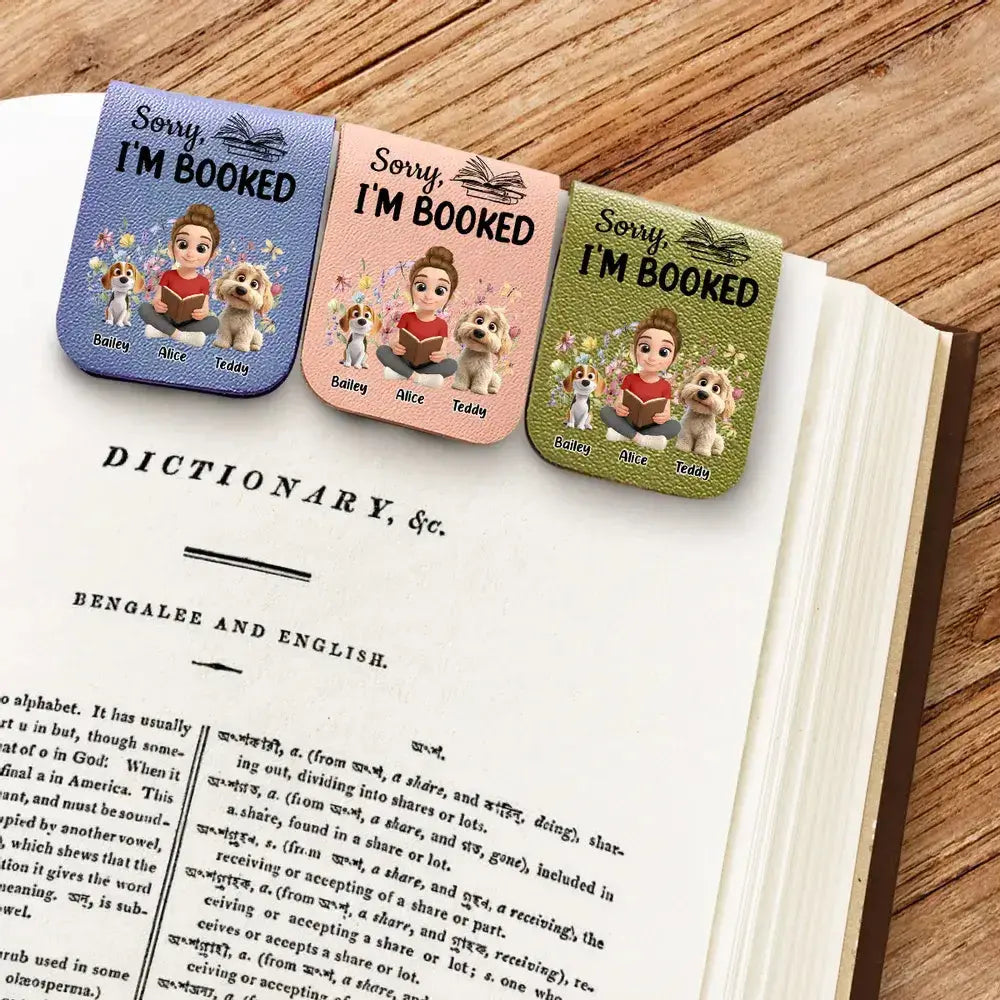 Three beautiful custom pet portrait bookmarks for readers resting on a novel