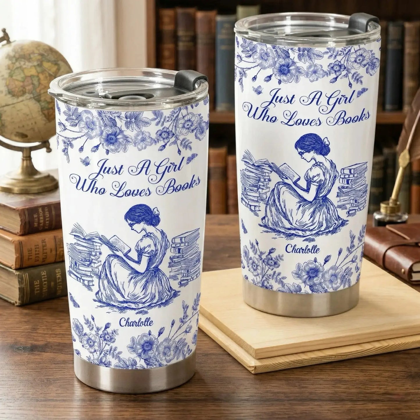 A personalized reading travel cup resting on a sturdy wooden desk