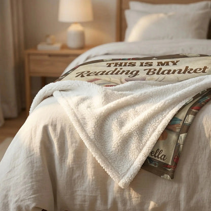 Folded personalized blanket for book lovers resting on a bed