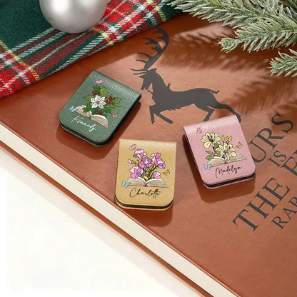 Flat lay of thoughtful gifts for book lovers including a floral page clip.