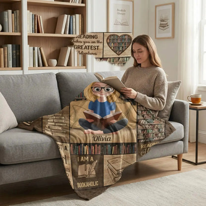 A woman wrapped in a personalized book lover reading blanket holding a cup of tea.