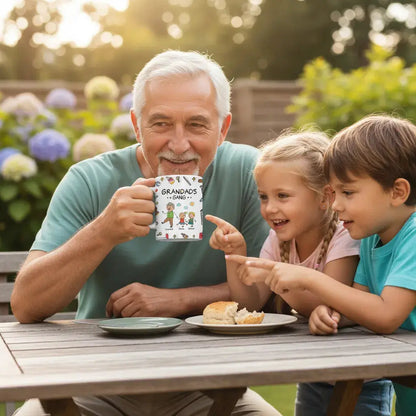 Grandfather with children at a table outdoors, holding a personalized dad mug.