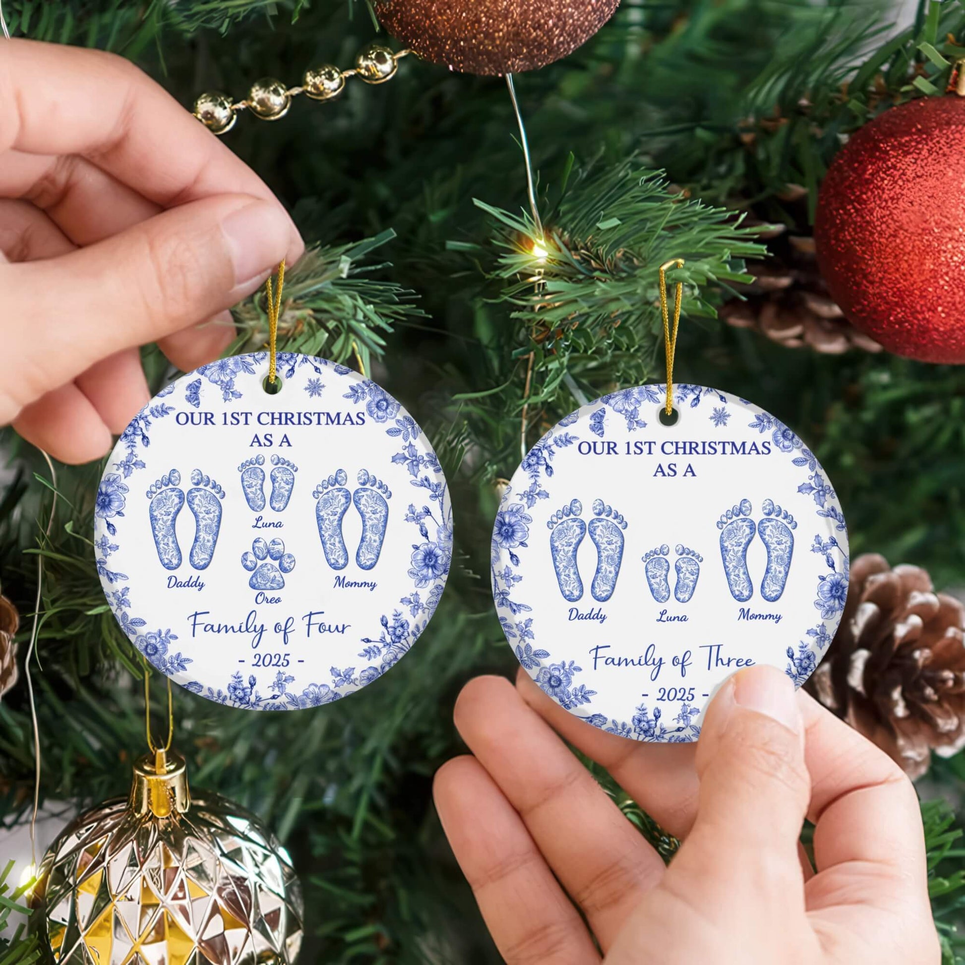 Two round custom ceramic ornaments with blue floral borders, personalized footprints and family names, 2025 Christmas.