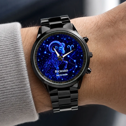 Personalized zodiac watch - black metal bracelet worn with a gray sweater