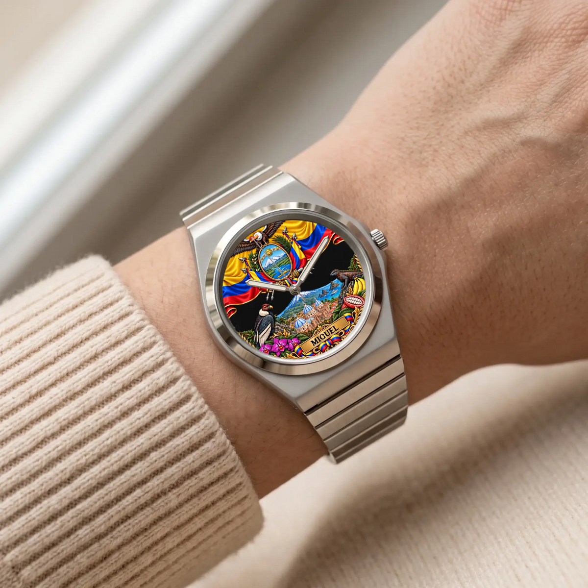 Personalized Ecuador watch with custom name, silver-tone Signature Round bracelet worn with a cream sleeve