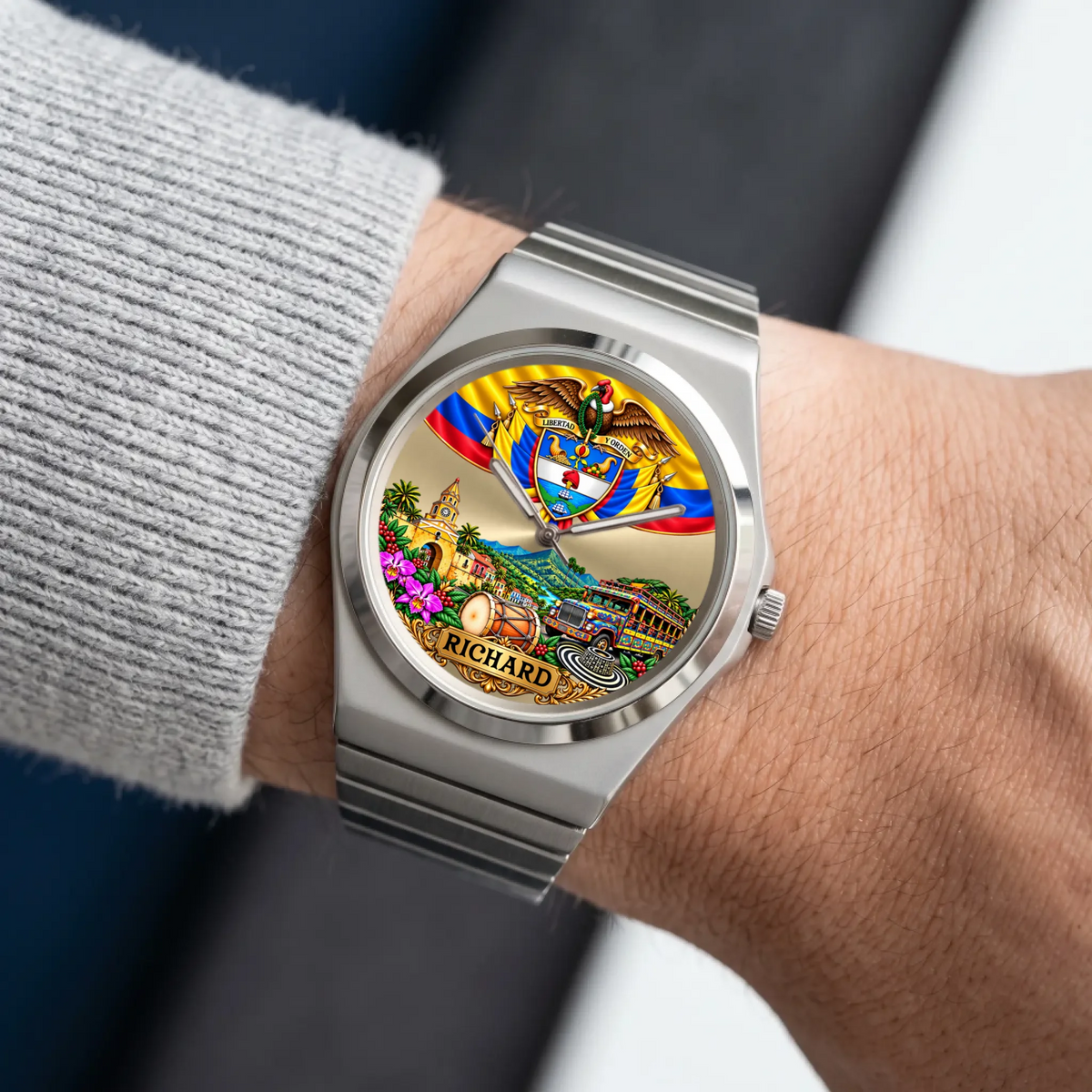 Personalized Colombian watch with custom name, silver-tone Signature Round bracelet worn with a gray sleeve