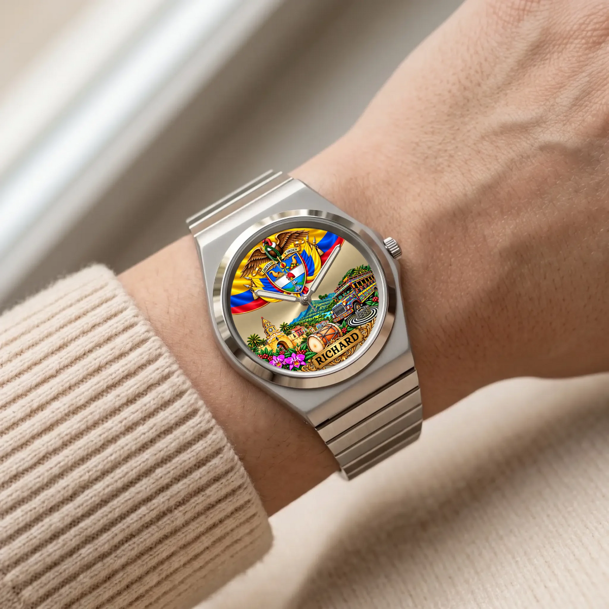 Personalized Colombian watch with custom name, silver-tone Signature Round bracelet worn with a cream sleeve