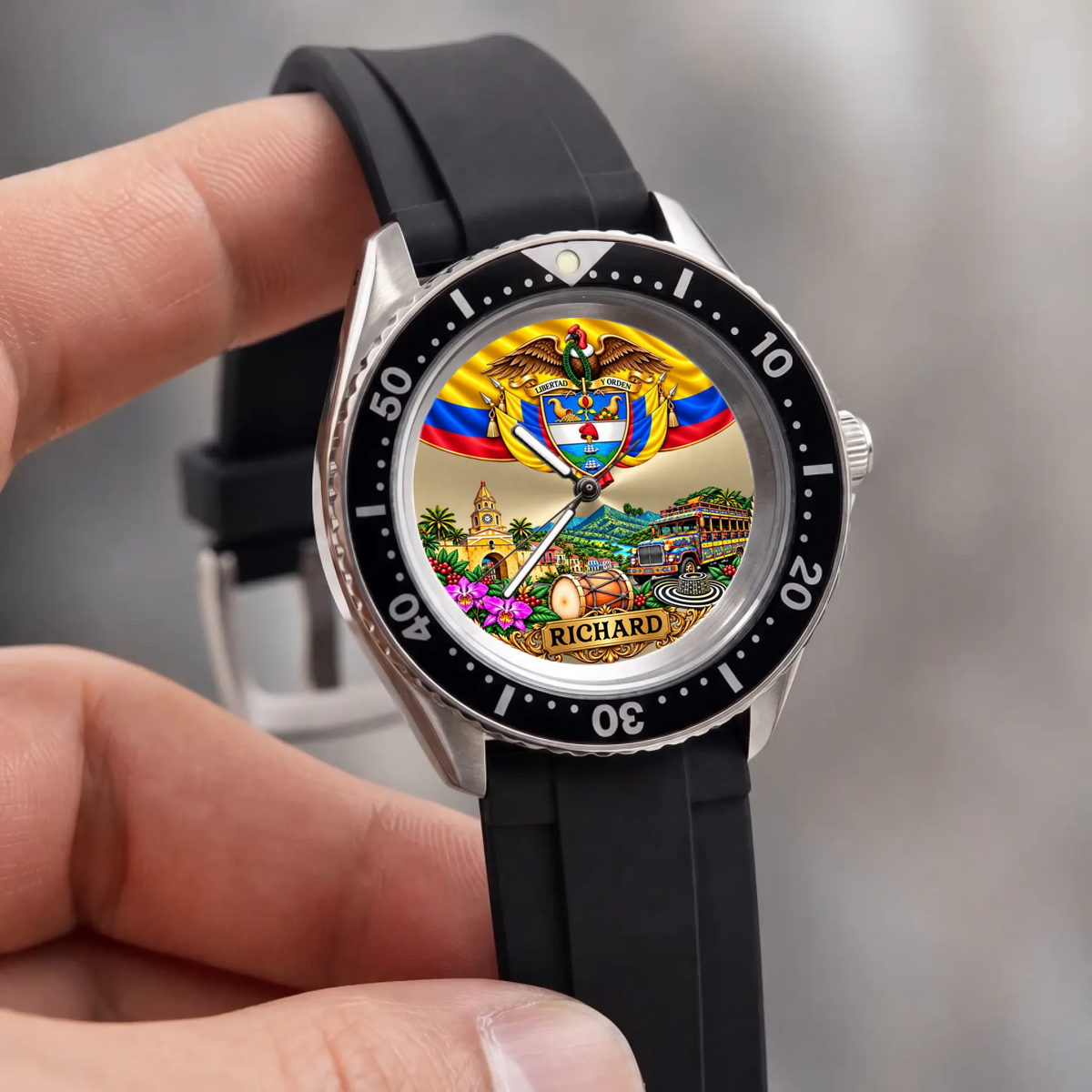 Personalized Colombian watch with custom name, Rift Diver style with black strap held against a light background