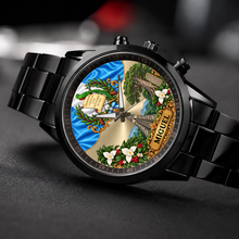 Personalized Guatemala watch with custom name, black metal bracelet, angled view on dark fabric
