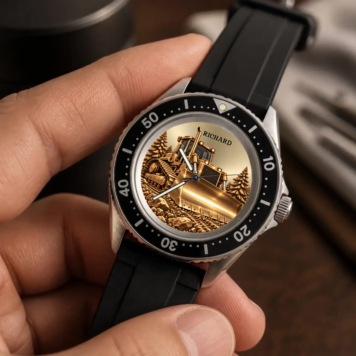 Angled close-up of the RIFT DIVER bulldozer watch showing personalized dial and black strap