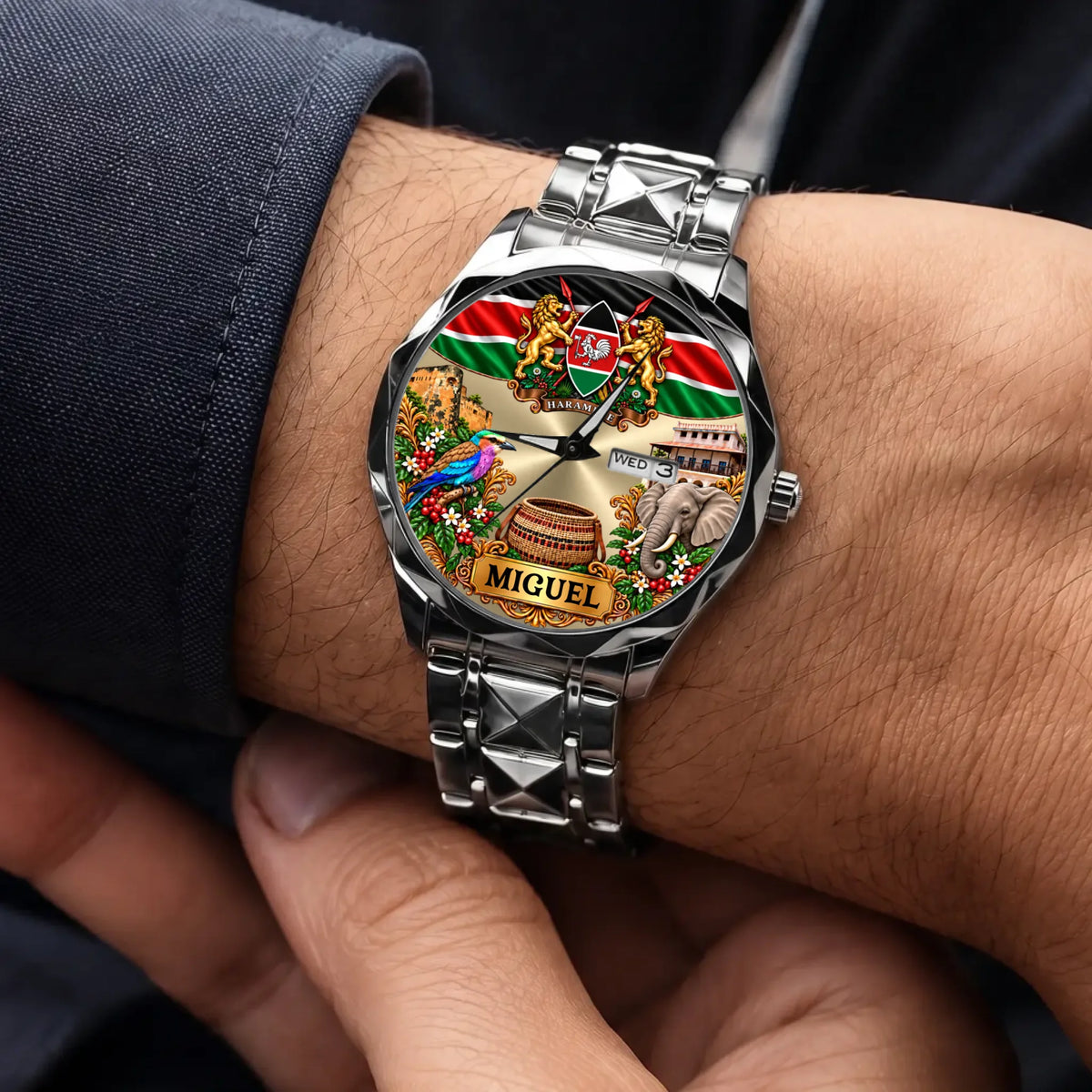 Silver-tone personalized Kenya calendar watch shown on the wrist with a dark sleeve