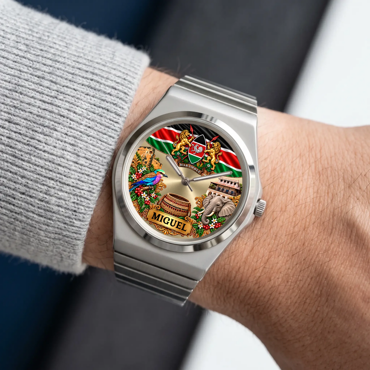 Silver-tone Signature Round Kenya heritage watch worn beside a gray sweater sleeve
