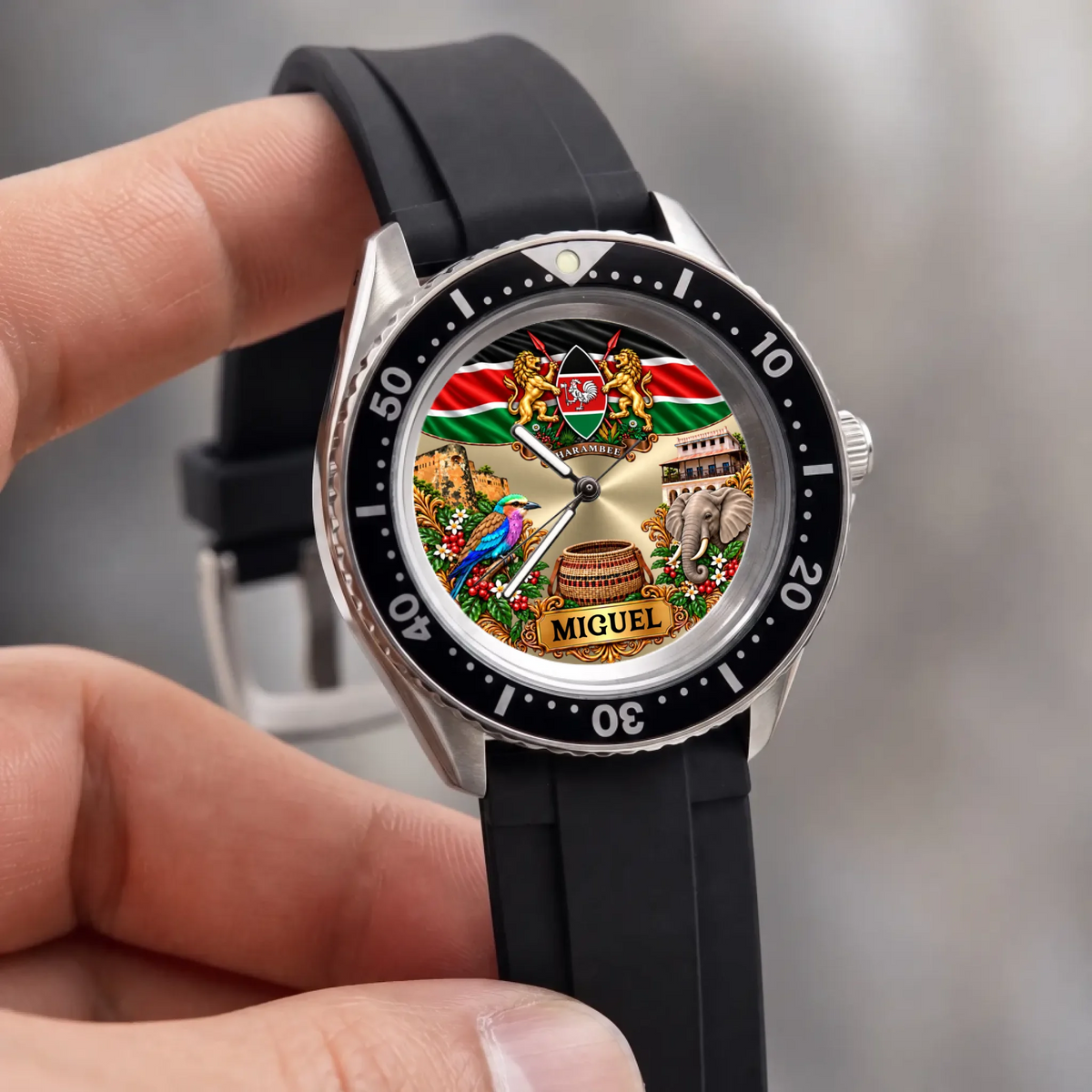 Hand-held close-up of the RIFT DIVER Kenya watch with flag, elephant and custom name artwork
