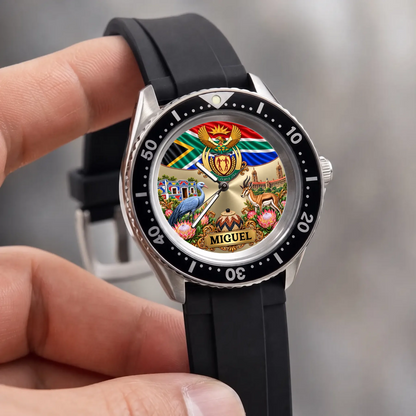 Hand-held close-up of the RIFT DIVER South Africa watch with flag, protea flowers and custom name