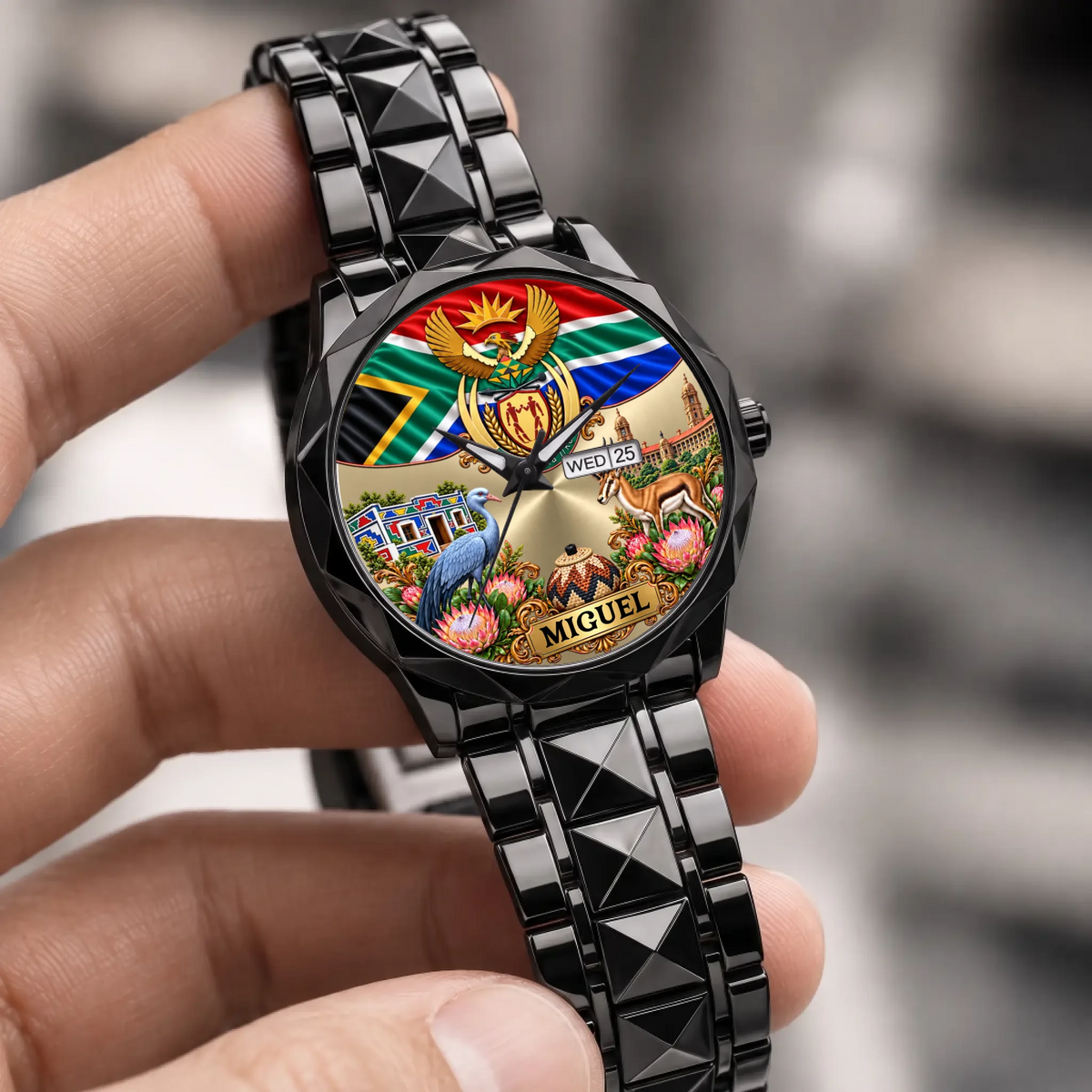 Black South Africa coat of arms calendar watch held in the hand, showing the personalized dial