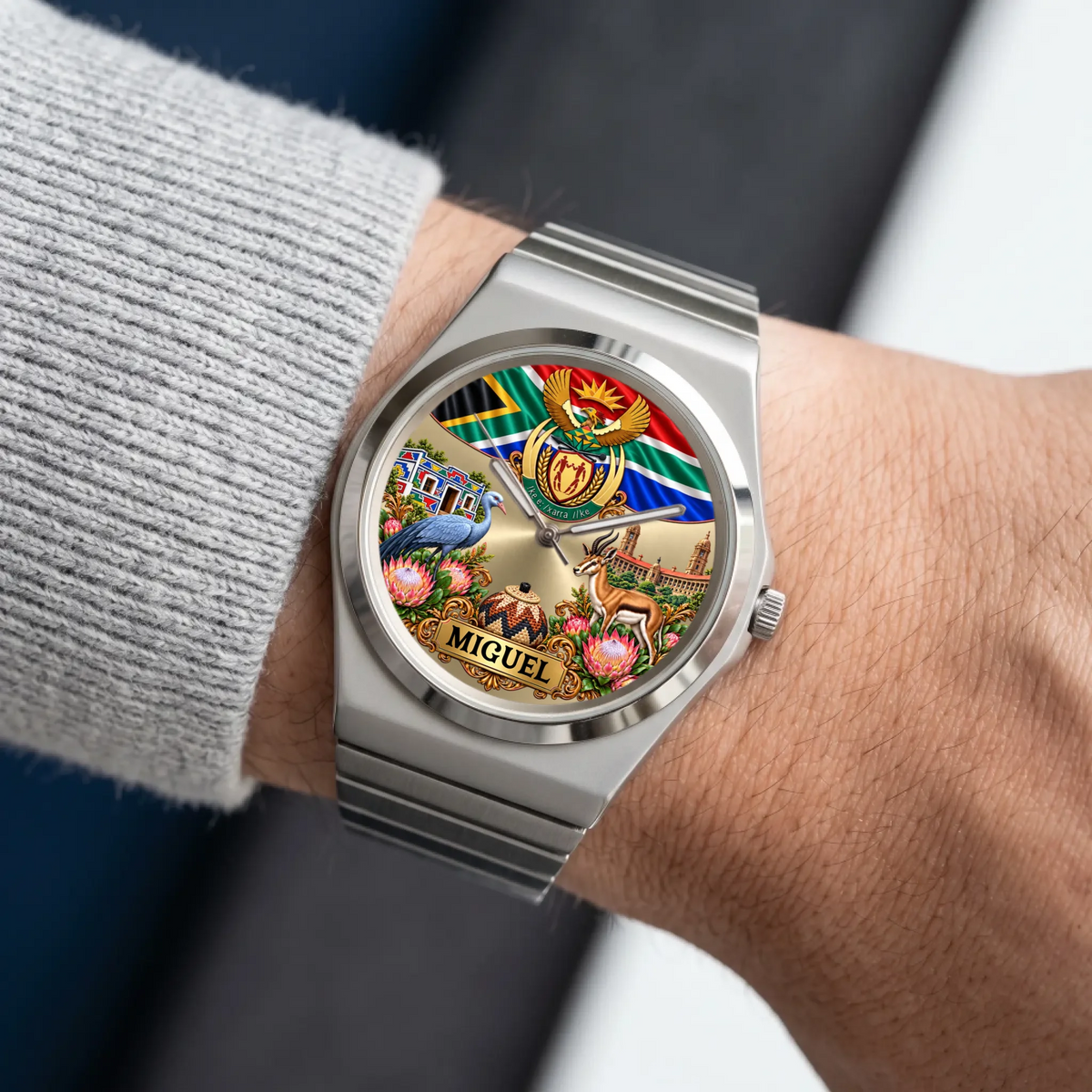 Silver-tone Signature Round South Africa watch worn beside a gray sweater sleeve