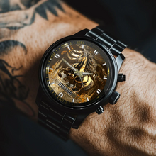 Rider checking the time on their custom metal watch before an evening trail run.