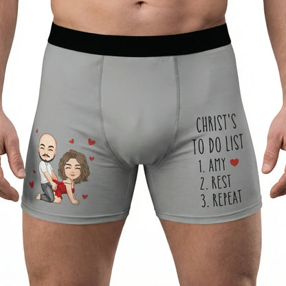 Gray custom boxer briefs with a cartoon couple and text on a white background