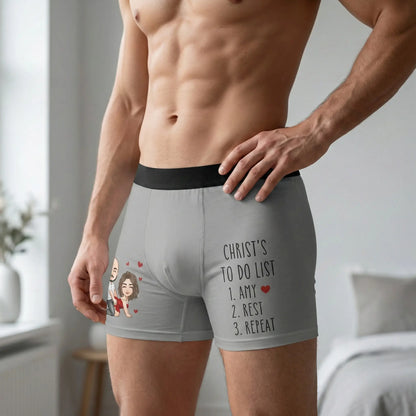 Person wearing a pair of gray custom boxer briefs with text and graphics.