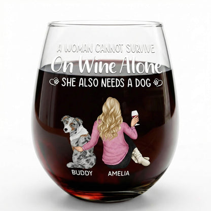 Personalized Wine glasses with text 'A woman cannot survive on wine alone. She also needs a dog.' and illustrations of a woman and a dog.