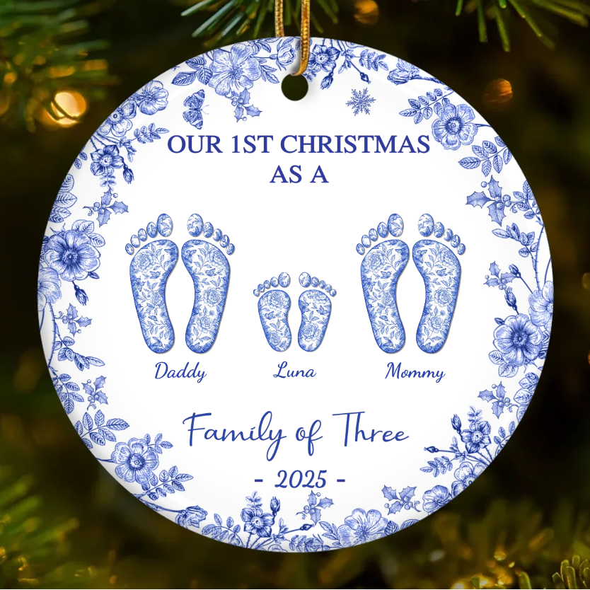 Blue floral round ceramic ornament with three footprints labeled Daddy, Luna, Mommy — Family of Three 2025